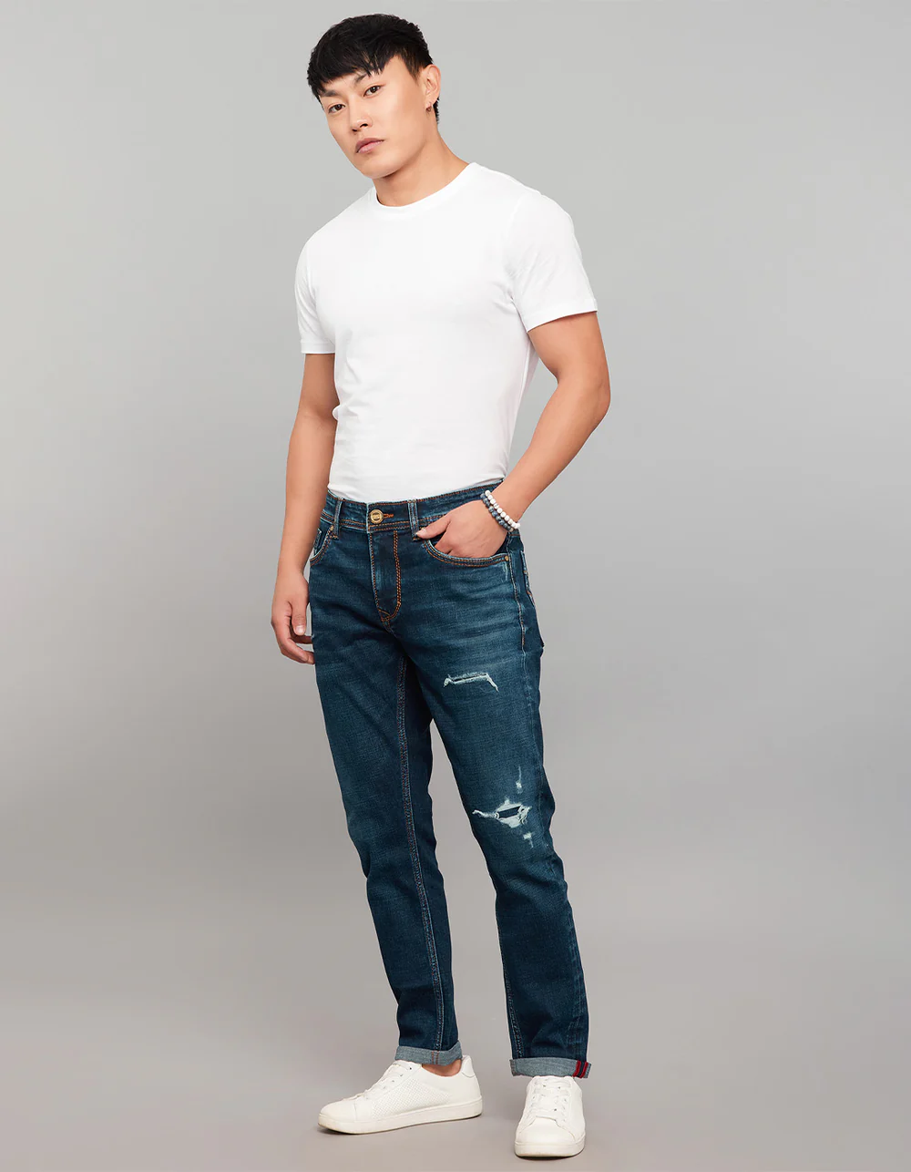 dark blue 5 pocket low rise tapered ankle length stretch jeans dark blue 5 pocket low rise tapered ankle length stretch jeans