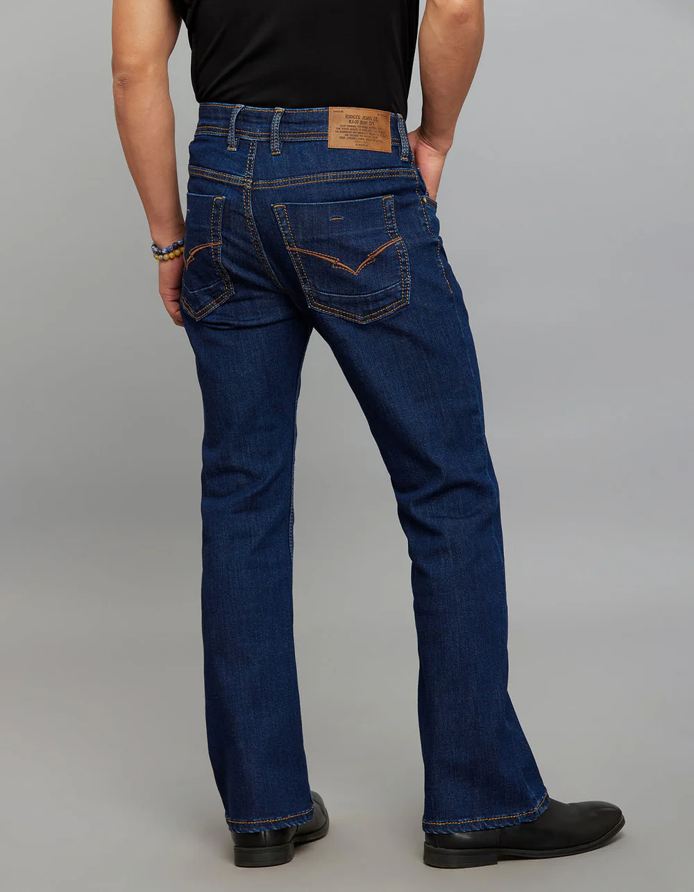 dark blue 5 pocket mid rise cropped length loose boot leg stretch jeans dark blue 5 pocket mid rise cropped length loose boot leg stretch jeans