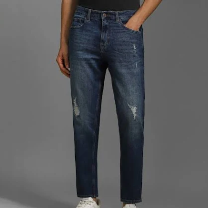 dark blue 5 pocket low rise tapered ankle length knit denim jeans dark blue 5 pocket low rise tapered ankle length knit denim jeans