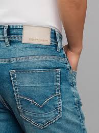 medium blue 5 pocket low rise tapered ankle length stretch jeans medium blue 5 pocket low rise tapered ankle length stretch jeans