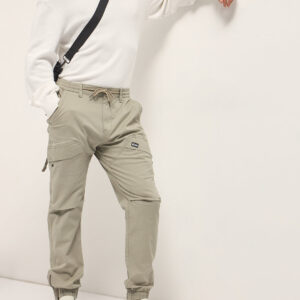 beige cotton relaxed fit cargo pants with elastic waist and utility pockets