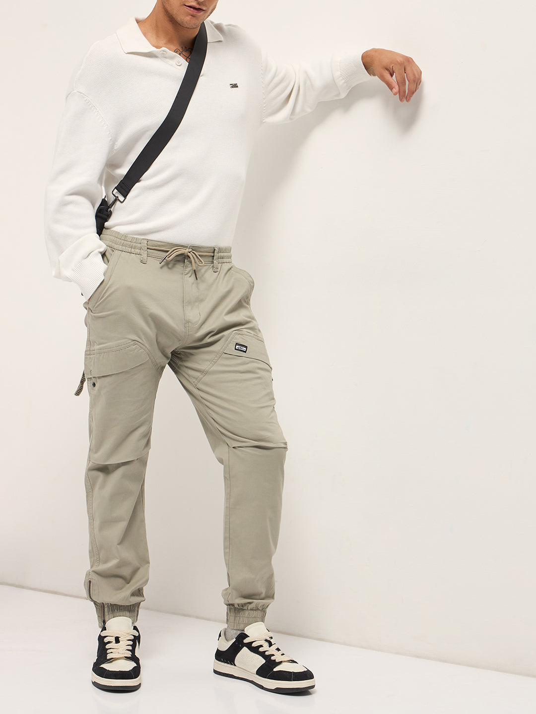 beige cotton relaxed fit cargo pants with elastic waist and utility pockets beige cotton relaxed fit cargo pants with elastic waist and utility pockets