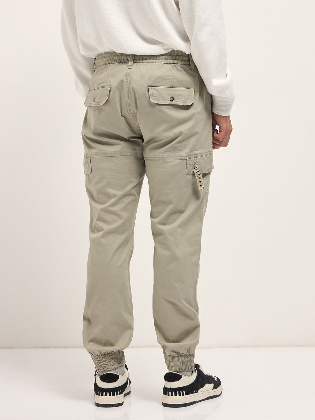 beige cotton relaxed fit cargo pants with elastic waist and utility pockets beige cotton relaxed fit cargo pants with elastic waist and utility pockets