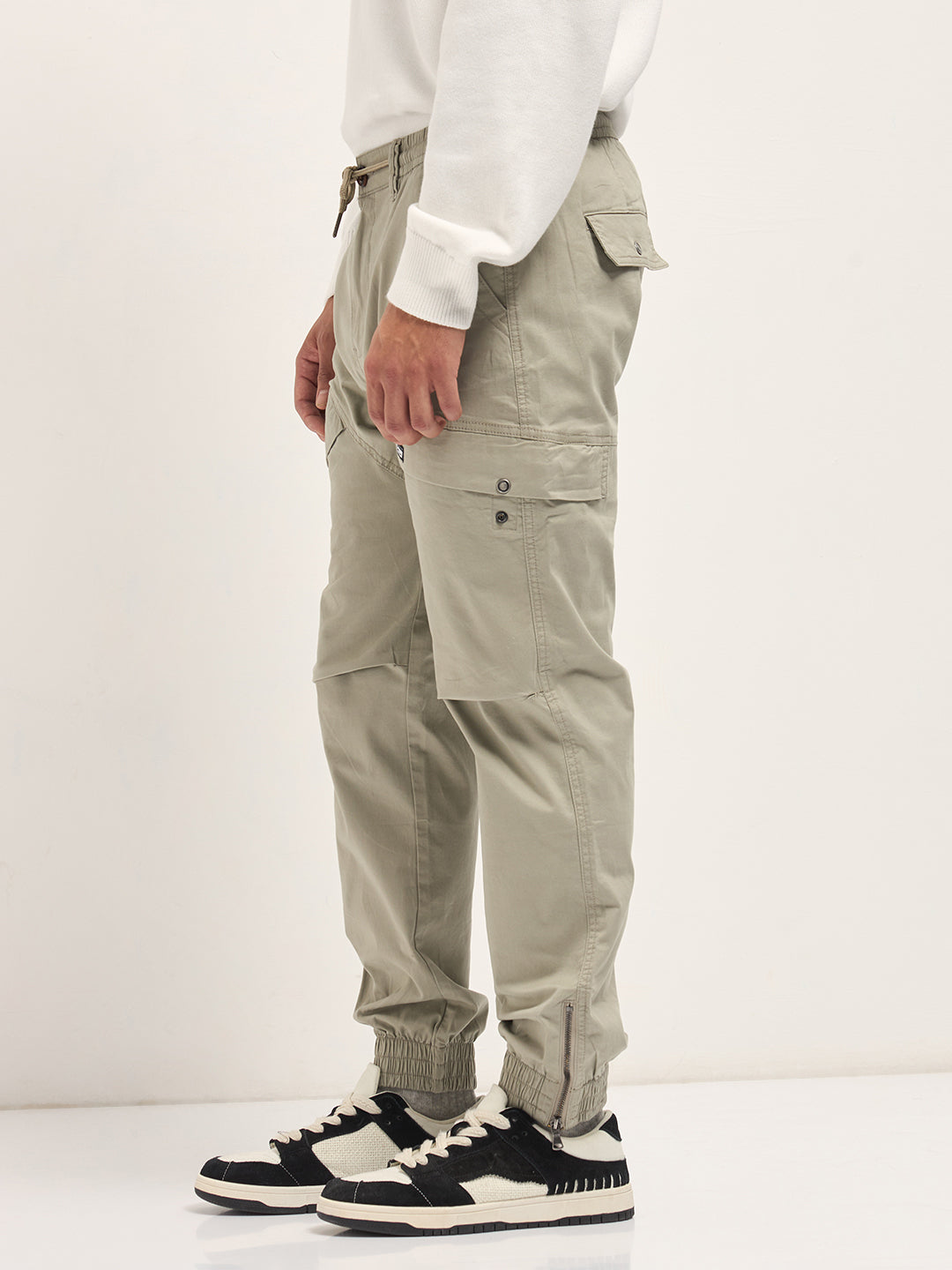 beige cotton relaxed fit cargo pants with elastic waist and utility pockets beige cotton relaxed fit cargo pants with elastic waist and utility pockets