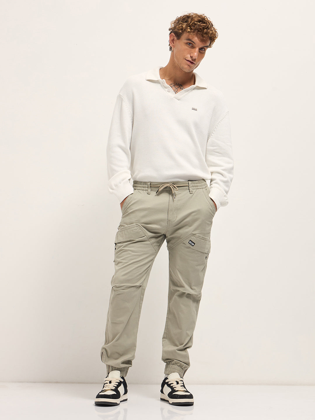 beige cotton relaxed fit cargo pants with elastic waist and utility pockets beige cotton relaxed fit cargo pants with elastic waist and utility pockets