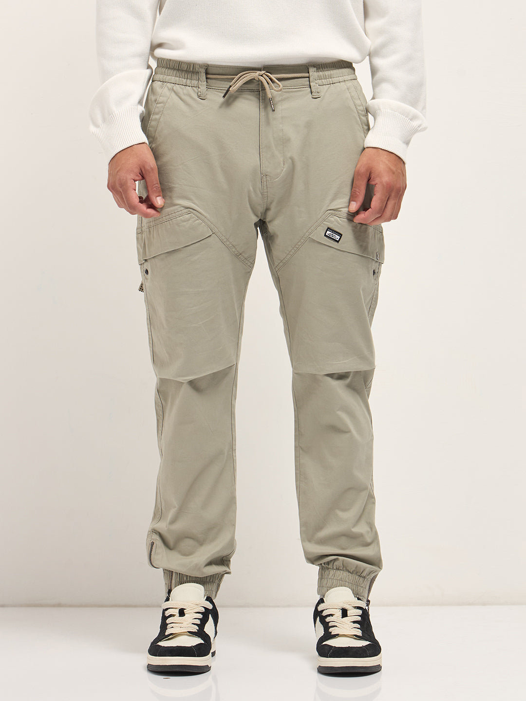 beige cotton relaxed fit cargo pants with elastic waist and utility pockets beige cotton relaxed fit cargo pants with elastic waist and utility pockets